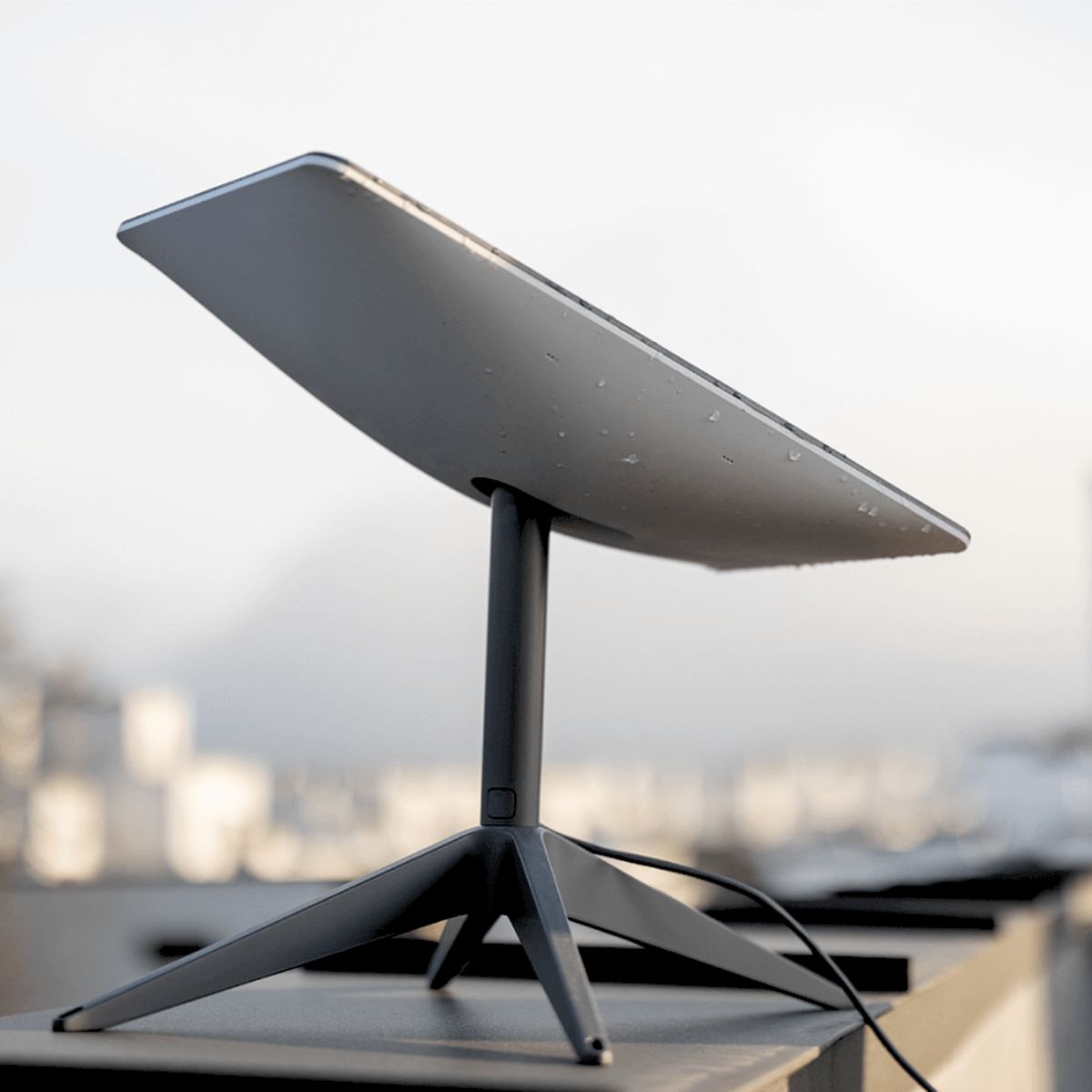 Black tablet with starlink cable stand on a caravan