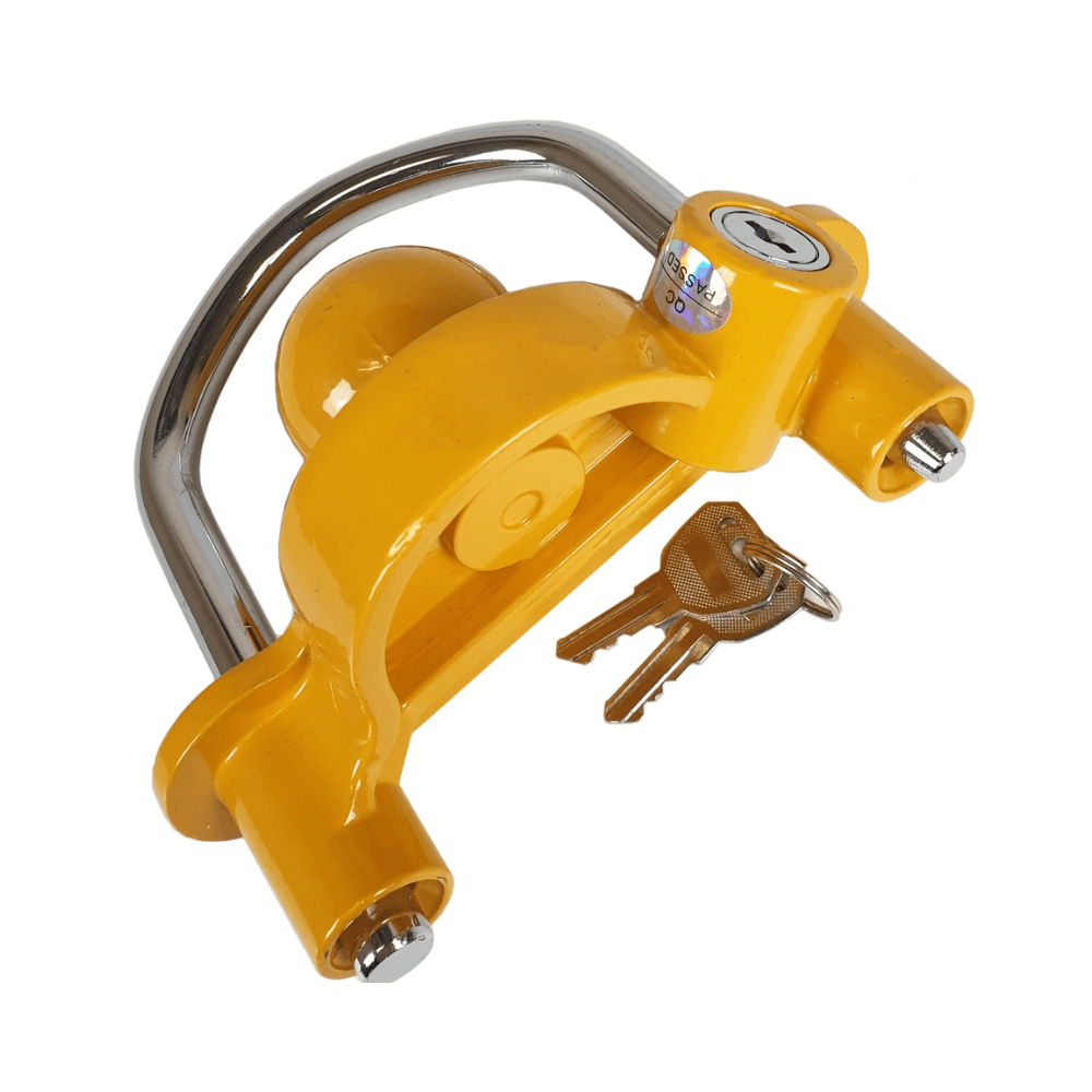 Yellow trailer lock with keys, designed to secure a trailer to a hitch.