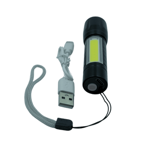 Black flashlight with USB cable on a transparent background