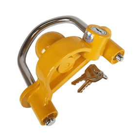 Yellow trailer lock with keys, designed to secure a trailer to a hitch.